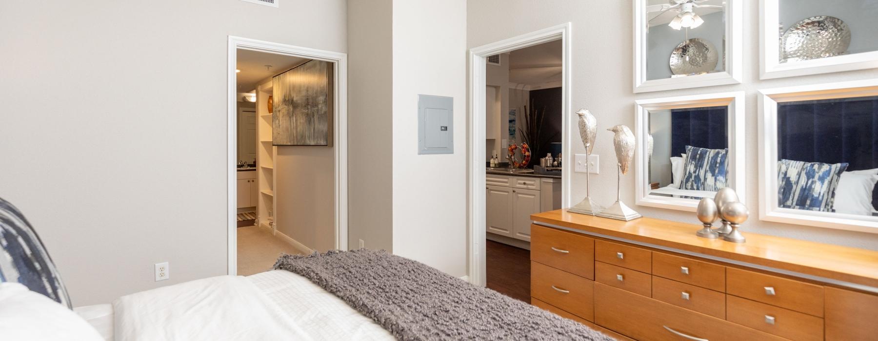 a bedroom with a bed and a dresser