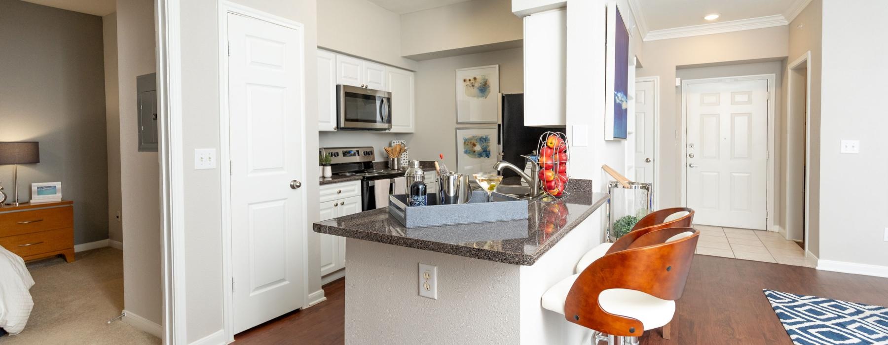a kitchen with a bar and island
