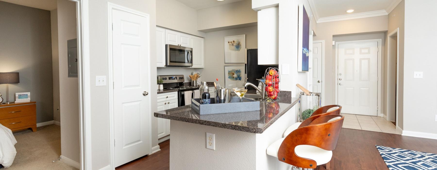 a kitchen with a bar and island